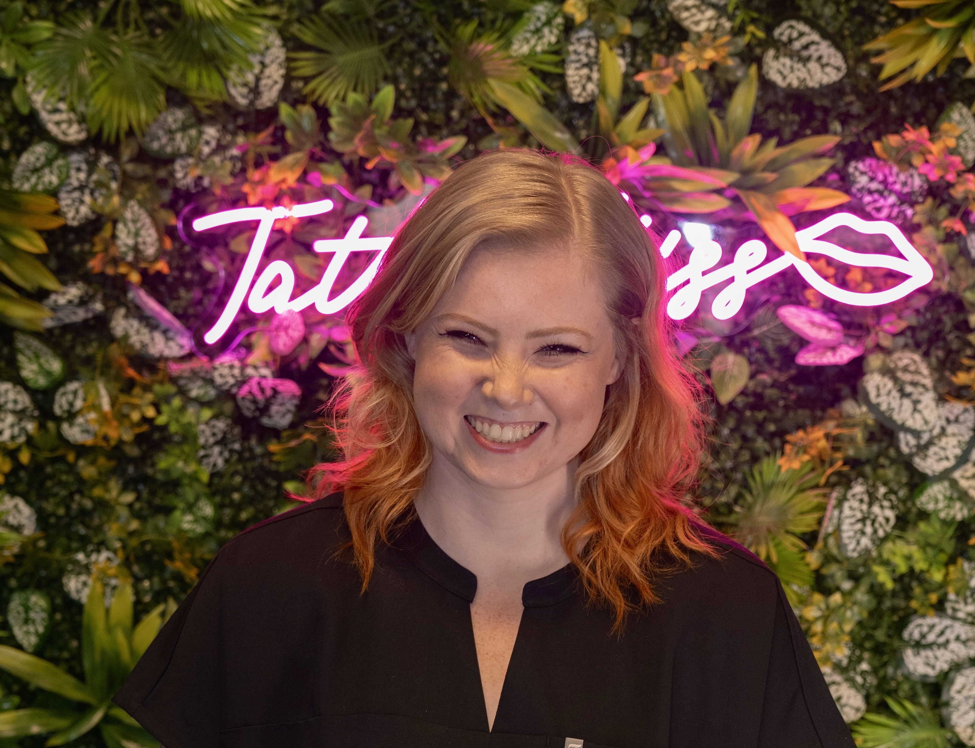 Tattoo Kiss shop owner Melissa Burns Mugisha